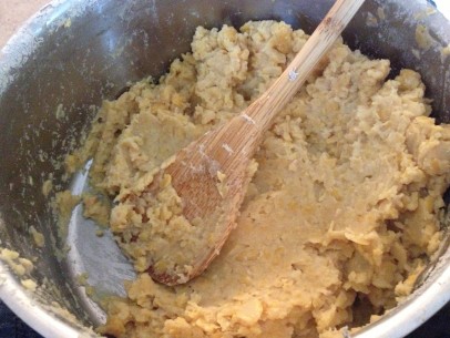 gently mash with wooden spoon