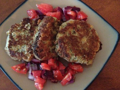 chickpea fritters with red onions a chopped tomatoes