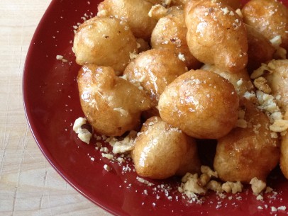 loukoumades with sweet syrup and chopped walnuts