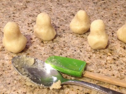 shape heaping tablespoon sized amounts of almond paste into pears