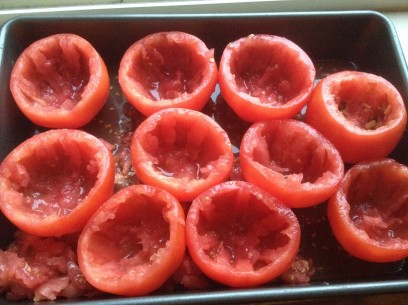 similar sized and shaped large tomatoes ready for stuffing 